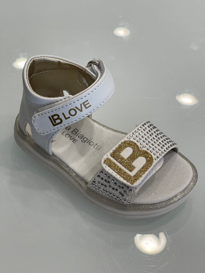 LAURA BIAGIOTTI - Sandalo bianco con logo oro e strass