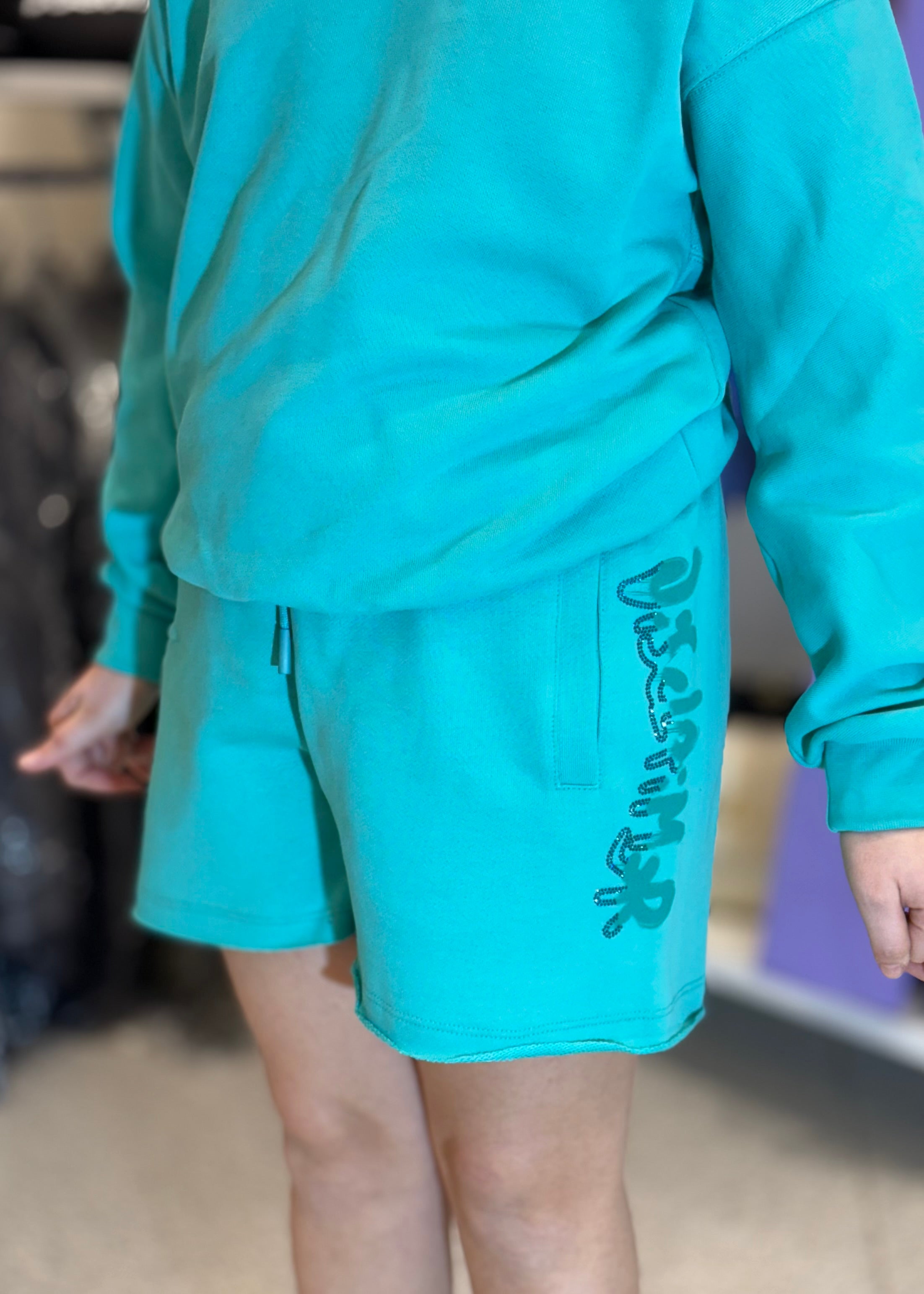 DISCLAIMER - Short verde menta con logo in strass bambina