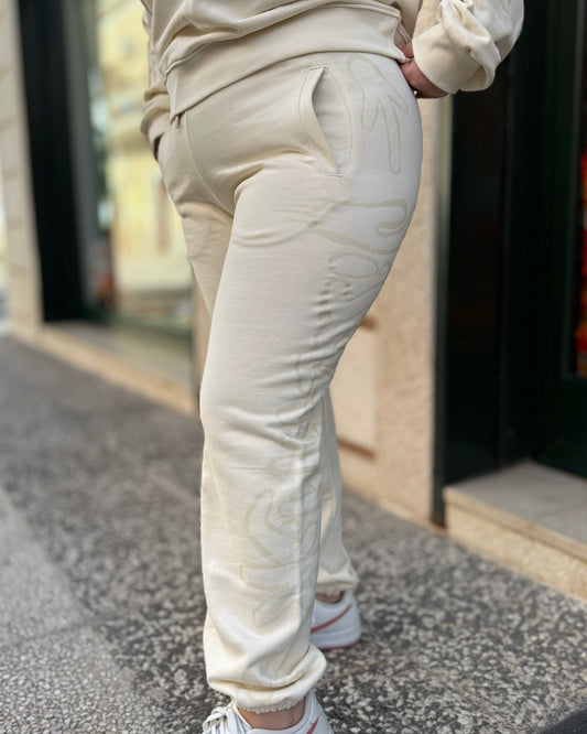 DISCLAIMER - Pantalone panna con logo in glitter donna